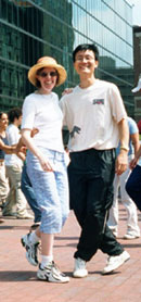 Kelly & Brian dancing at the Boston Lindy Hop Dance Invasion 2000. John Hancock building, with its mirrored exterior of windows, can be seen in the background. Photo courtesy of Seamus Waldrum.