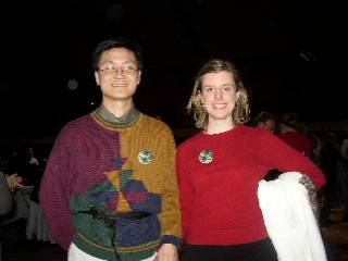 Kelly and Brian hold hands and pose for a picture