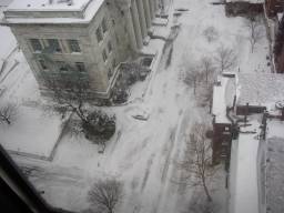A view looking straight down at a car that appears very tiny