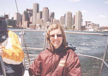 Ahoy there sailor. Kelly sailing on the harbor with the skyline in the background.