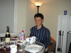 Brian smiles looking at his birthday cake